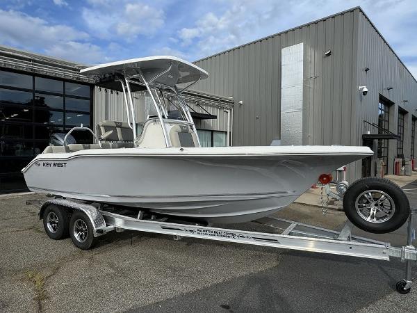 Key West 219fs 2025 Key West 219fs boat on trailer outside industrial building.