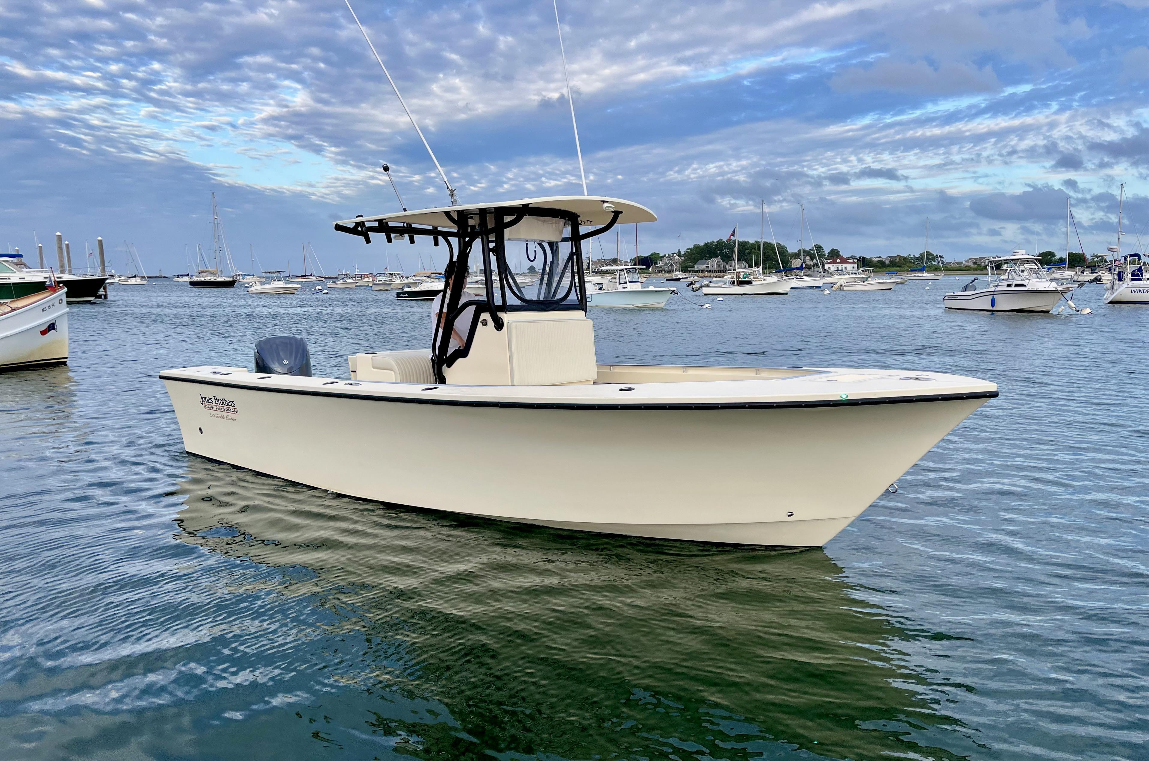 Jones Brothers Cape Fisherman 26 Light Tackle 2024 Jones Brothers Cape Fisherman 26 Light Tackle boat on calm water under cloudy sky.
