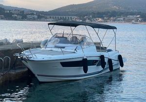 Jeanneau Cap Camarat 9.0 wa 2018 Jeanneau Cap Camarat 9.0 WA boat docked by the shore, scenic background.