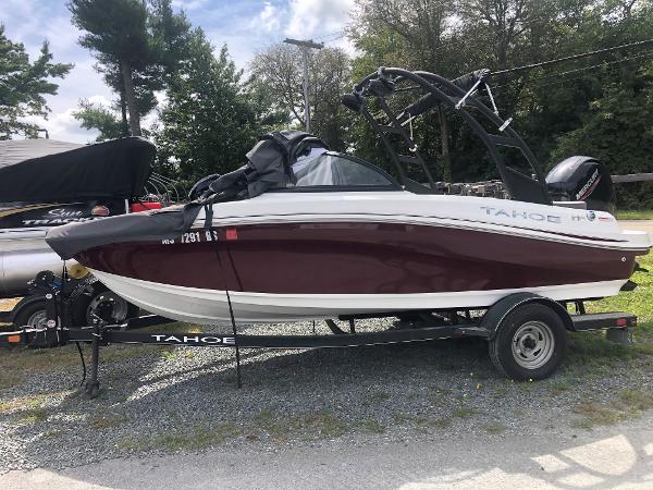Tahoe 185 S 2022 Tahoe 185 S boat on trailer, parked outdoors.