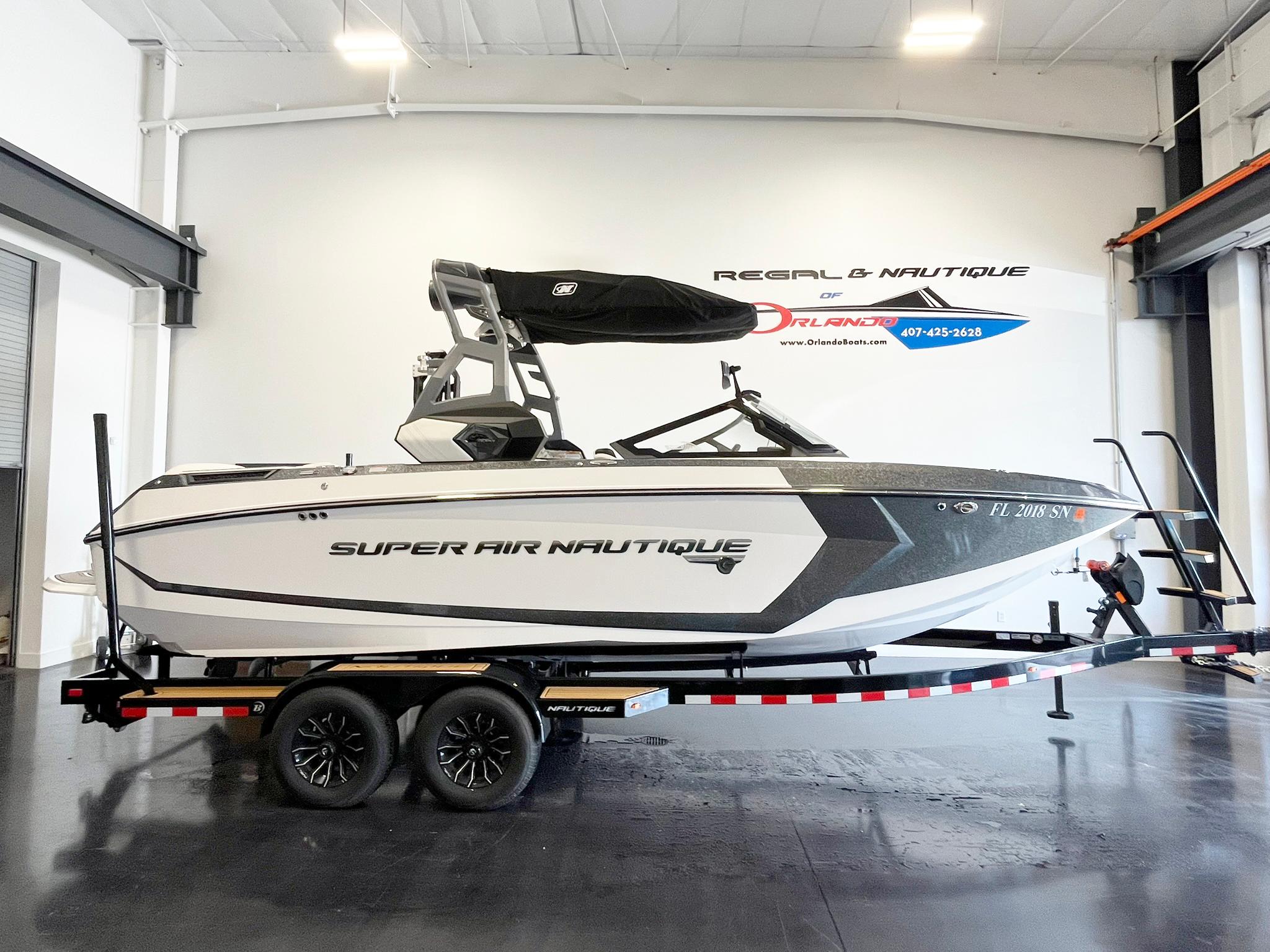 Nautique Super Air G23 2020 Nautique Super Air G23 boat on trailer in showroom.