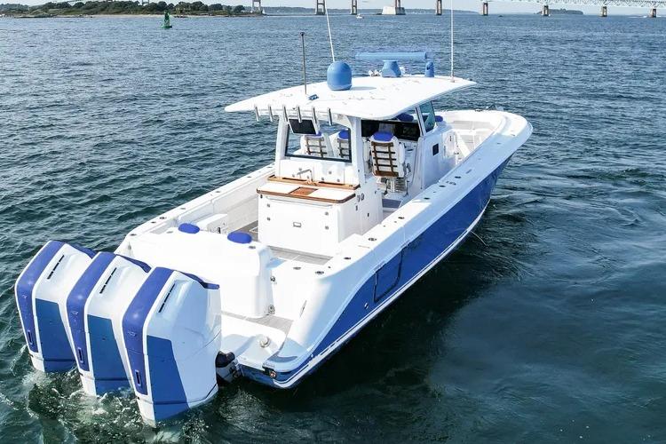 HCB 42 Lujo 2025 HCB 42 Lujo boat with triple engines cruising on open water.