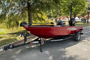 Tracker Super Guide V-16 T 2025 Tracker Super Guide V-16 T fishing boat on trailer, parked outdoors.