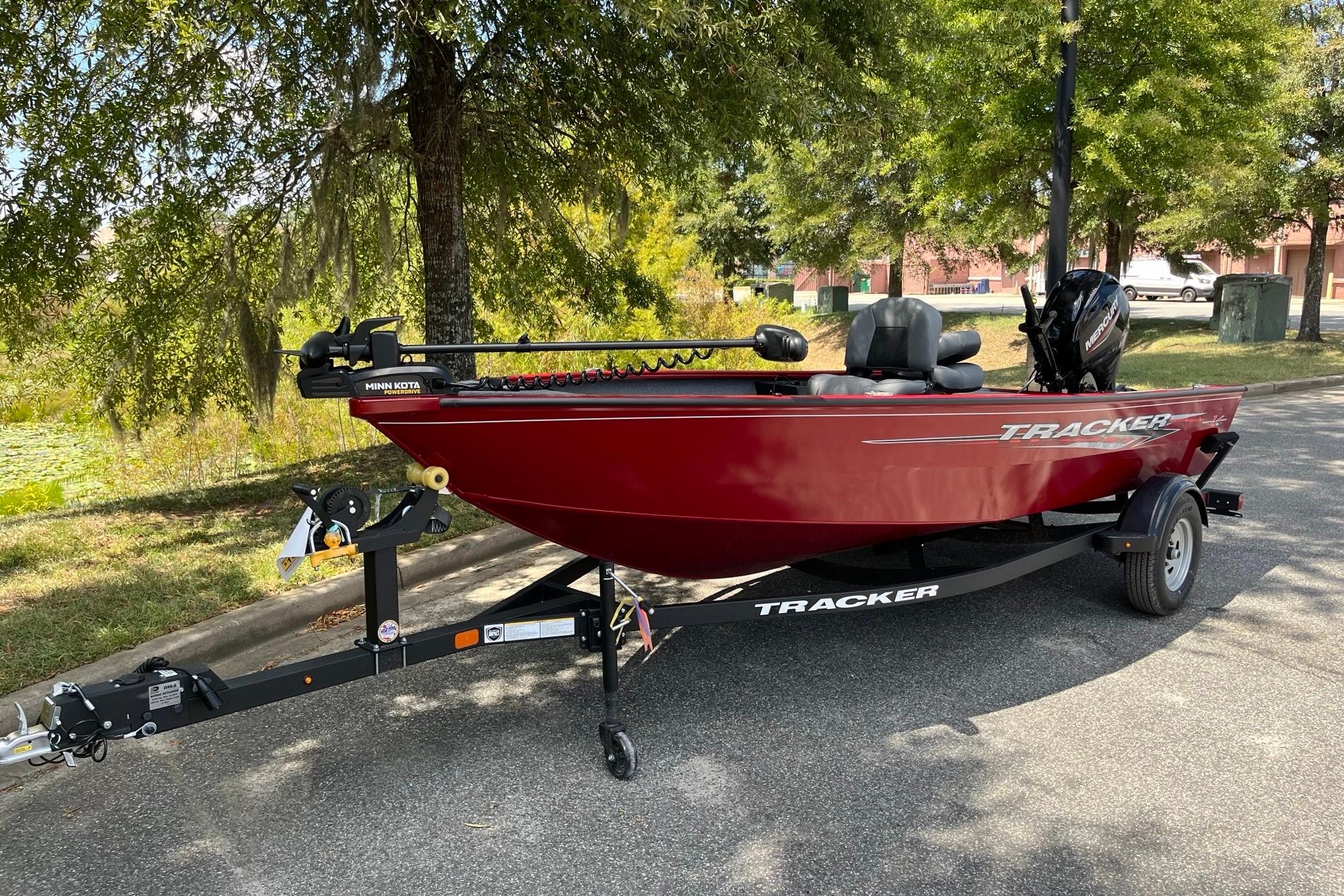 Tracker Super Guide V-16 T 2025 Tracker Super Guide V-16 T fishing boat on trailer, parked outdoors.