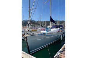 Jeanneau Sun Odyssey 42.2 2008 Jeanneau sailboat for sale, docked at marina with clear blue sky.