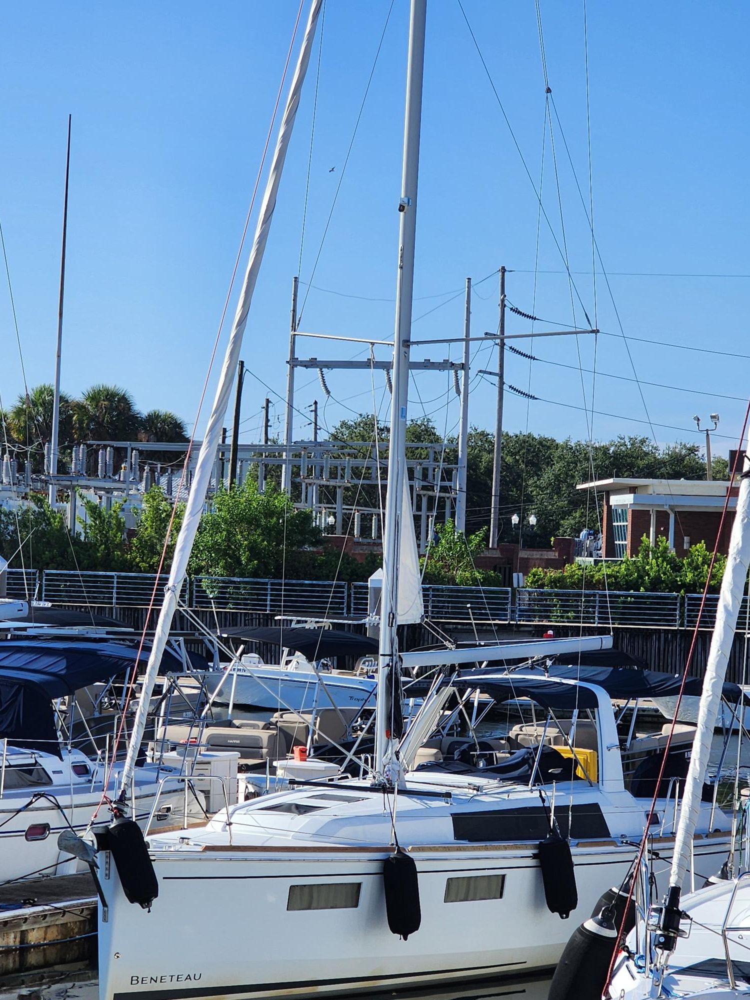 Beneteau Beneteau 35.1 2019 Beneteau 35.1 sailboat docked at a marina under clear blue skies.