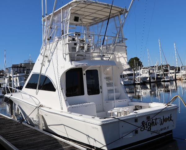 Luhrs 34 Convertible 2002 Luhrs 34 Convertible yacht docked at marina, rear view.
