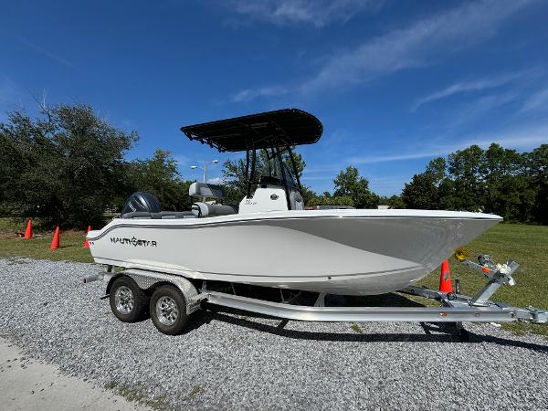NauticStar 212 Legacy 2025 NauticStar 212 Legacy boat on trailer, parked outdoors.