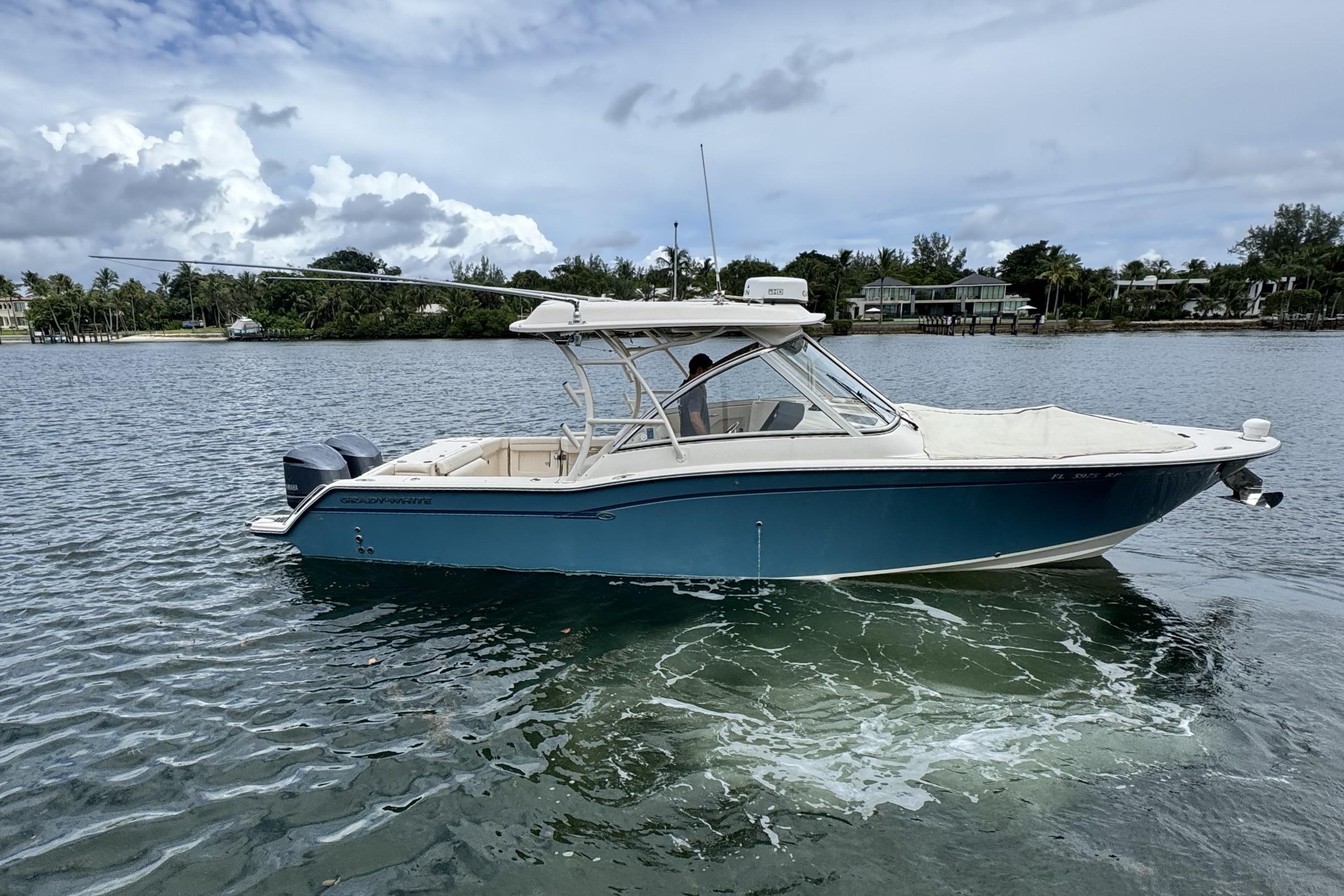 Grady-White Freedom 325 2018 Grady-White Freedom 325 boat on calm water under cloudy sky.