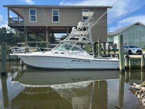 Rampage EXPRESS 2006 Rampage EXPRESS boat docked near waterfront homes.
