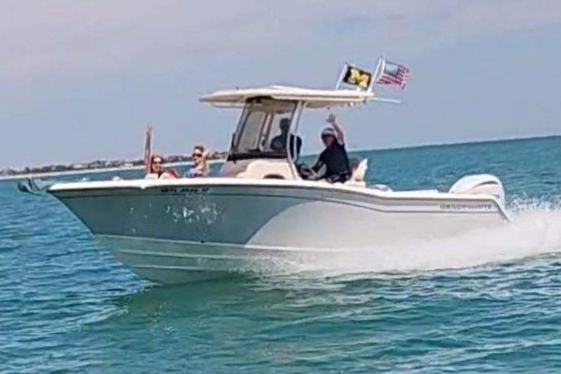 Grady-White Fisherman 236 2021 Grady-White Fisherman 236 boat cruising on clear blue water.
