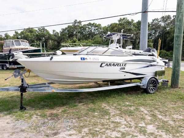 Caravelle 19 EBO 2015 Caravelle 19 EBO boat on trailer, parked outdoors.