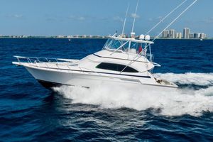 Bertram 510 Convertible 2001 Bertram 510 Convertible yacht cruising on open blue ocean waters.