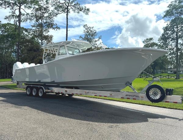 Onslow Bay 41TE 2024 Onslow Bay 41TE boat on trailer, parked outdoors under a cloudy sky.
