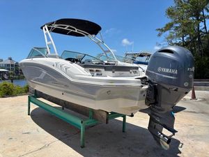 Chaparral 210 Suncoast Ski & Fish 2019 Chaparral 210 Deluxe boat with Yamaha engine on display outdoors.
