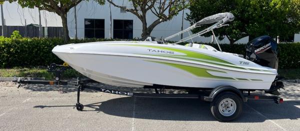 Tahoe T16 2024 Tahoe T16 boat with green accents on a trailer, parked outdoors.