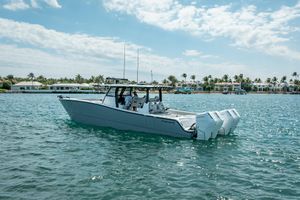 Freeman 42LR 2024 Freeman 42LR boat on water, with coastal homes in the background.