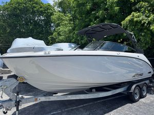 Yamaha Boats AR250 2025 Yamaha Boats AR250 on trailer, parked outdoors with trees in background.
