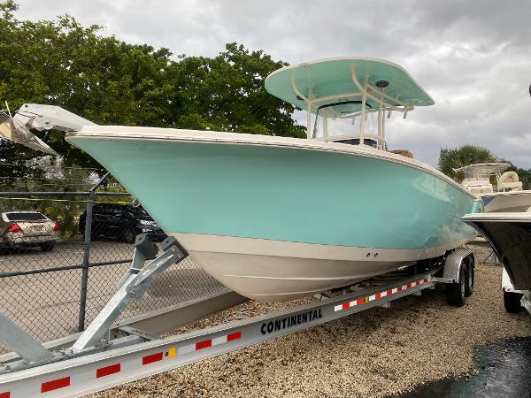 Sea Chaser 30 HFC CC 2023 Sea Chaser 30 HFC CC boat on trailer, light blue hull, parked outdoors.