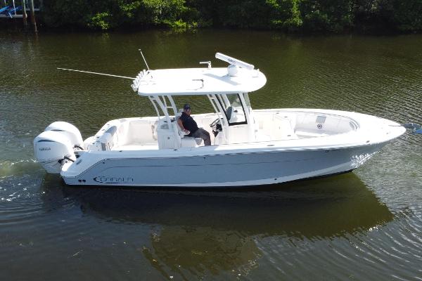 Robalo R302 Center Console 2021 Robalo R302 Center Console boat cruising on calm water.