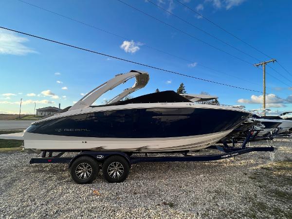 Regal LS9 2025 Regal LS9 boat on trailer under clear blue sky.