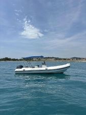 Capelli Tempest 650 2015 Capelli Tempest 650 boat on calm blue water under clear sky.