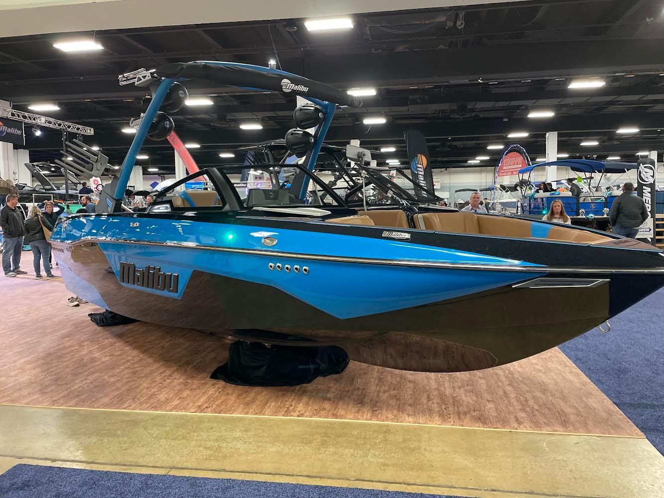 Malibu Wakesetter 23 LSV 2022 Malibu Wakesetter 23 LSV boat displayed at an indoor exhibition.