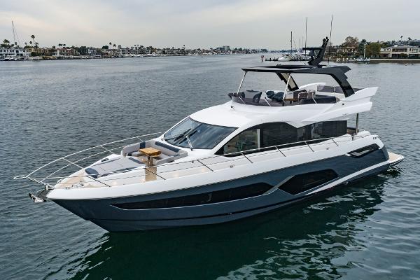Sunseeker Manhattan 68 2023 Sunseeker Manhattan 68 luxury yacht cruising on calm waters.