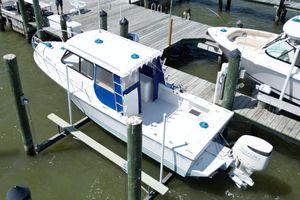 Judge 27 Chesapeake 2019 Judge 27 Chesapeake boat docked at marina with outboard motor.