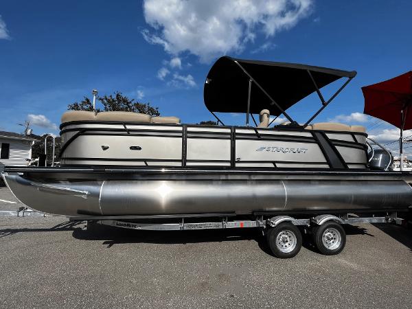 Starcraft SLS 3 2024 Starcraft SLS 3 pontoon boat on trailer under blue sky.