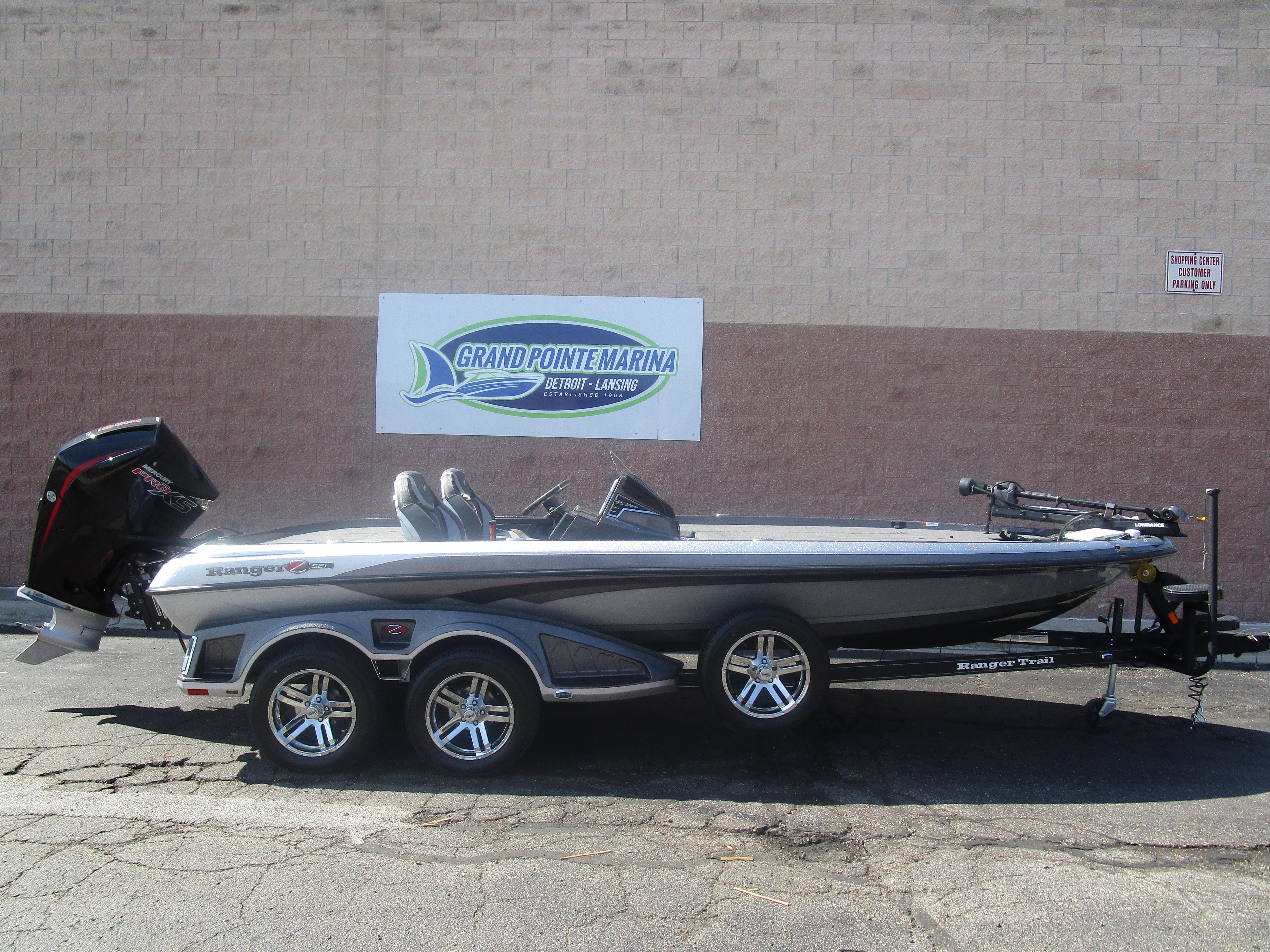 Ranger Z521R Ranger Cup Equipped 2024 Ranger Z521R boat at Grand Pointe Marina, side view with trailer.