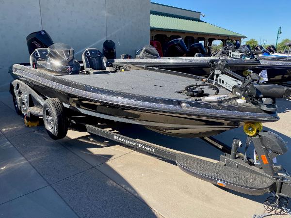 Ranger Z521R 2023 Ranger Z521R bass boat on trailer, parked outdoors.