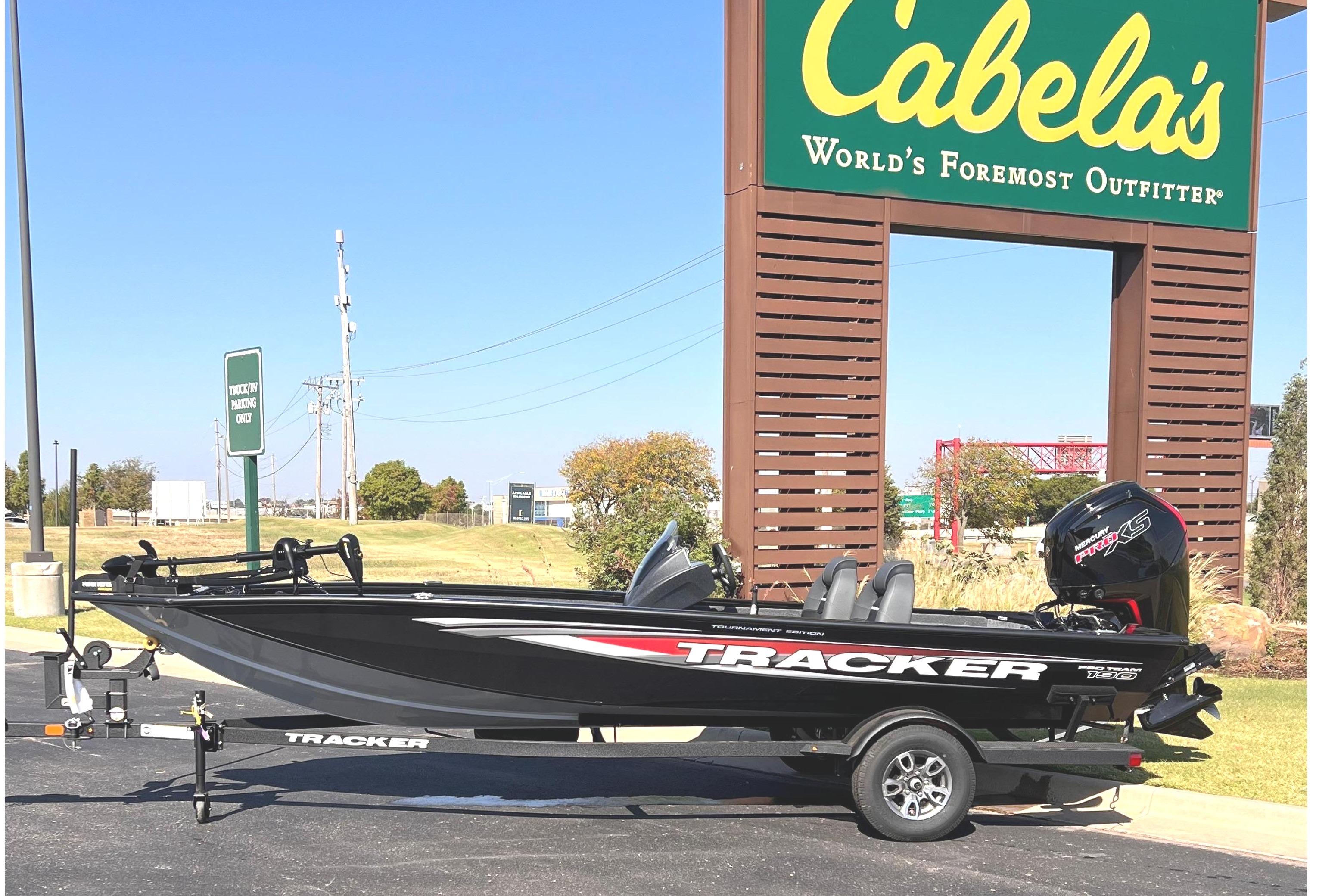 Tracker Pro Team 190 2026 Tracker Pro Team 190 boat parked at Cabela's outdoor store.