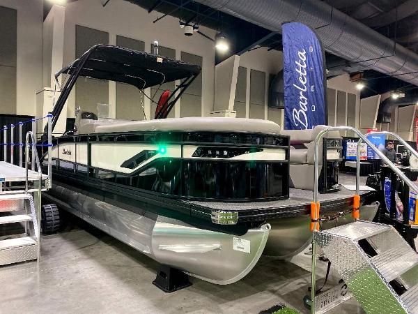 Barletta Corsa Ultra-Lounge 25UCA 2024 Barletta Corsa Ultra-Lounge 25UCA pontoon boat on display indoors.