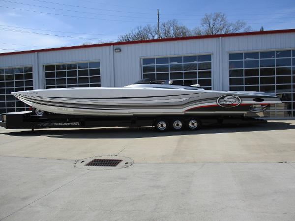 Skater 482 2012 Skater 482 speedboat on trailer outside garage.