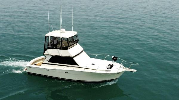 Viking Boats 35 Convertible 1986 Viking Boats 35 Convertible cruising on calm ocean waters.