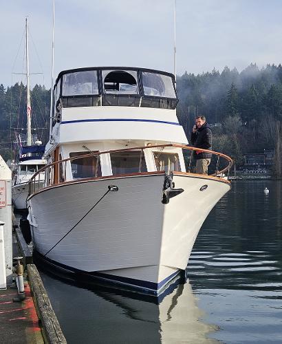 Ocean Alexander 43 1983 Ocean Alexander 43 yacht docked in a serene marina setting.