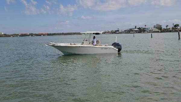 Key West 244 Center Console 2019 Key West 244 Center Console boat cruising on calm waters under a clear sky.