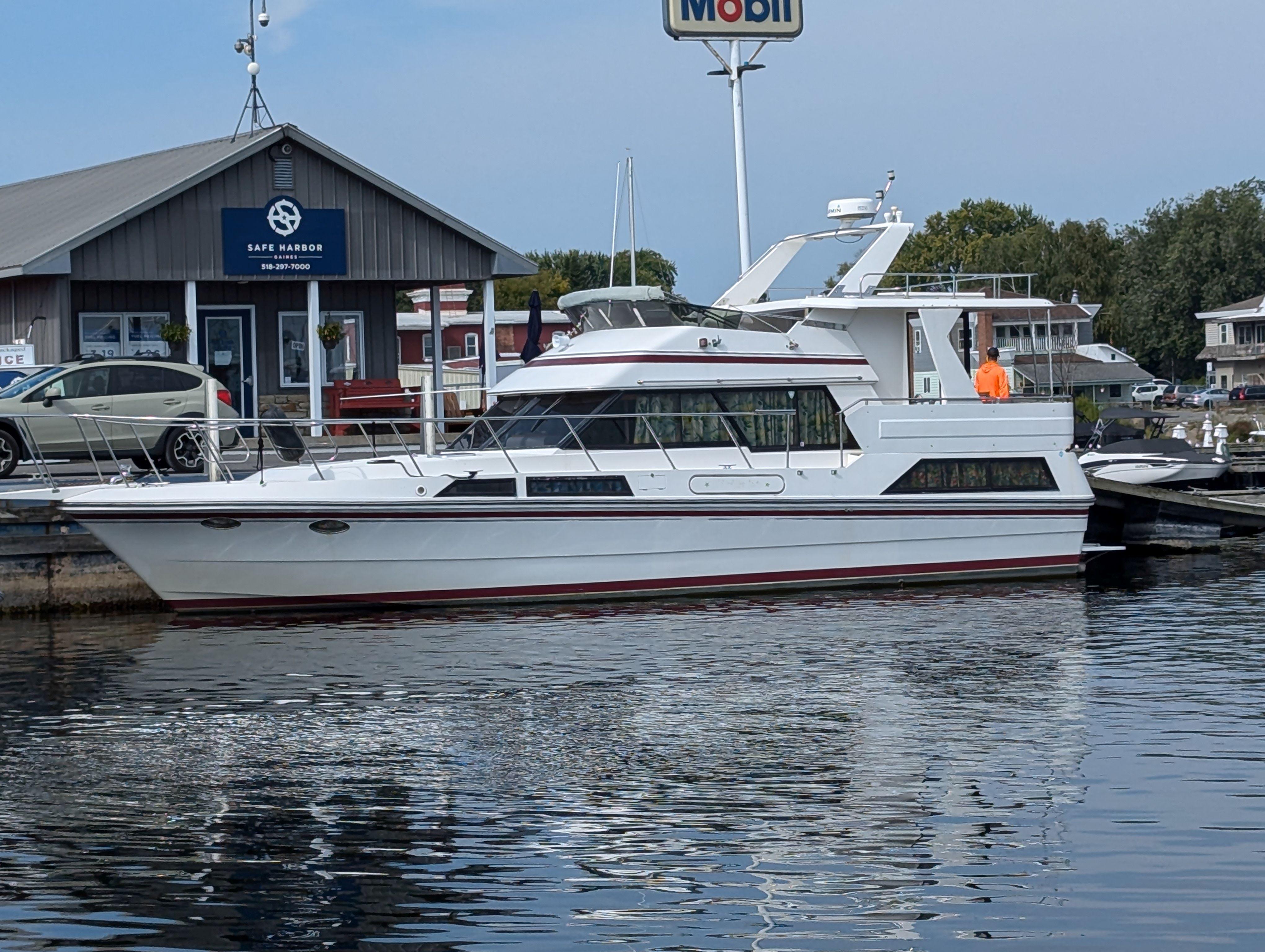 Custom Hi-tech 44 Custom Hi-tech 44 yacht docked at marina, Safe Harbor sign visible, 1988 model.