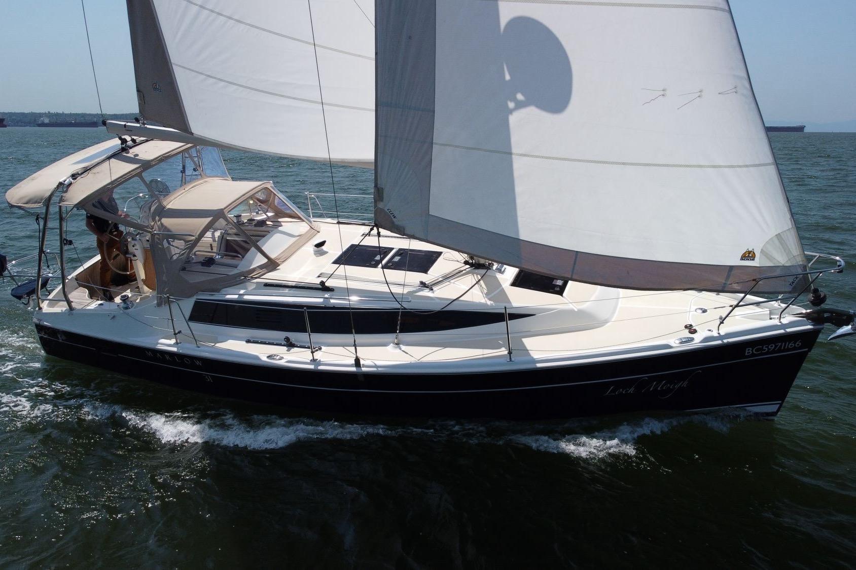 Marlow-Hunter 31 2018 Marlow-Hunter 31 sailboat cruising on open water with full sails.