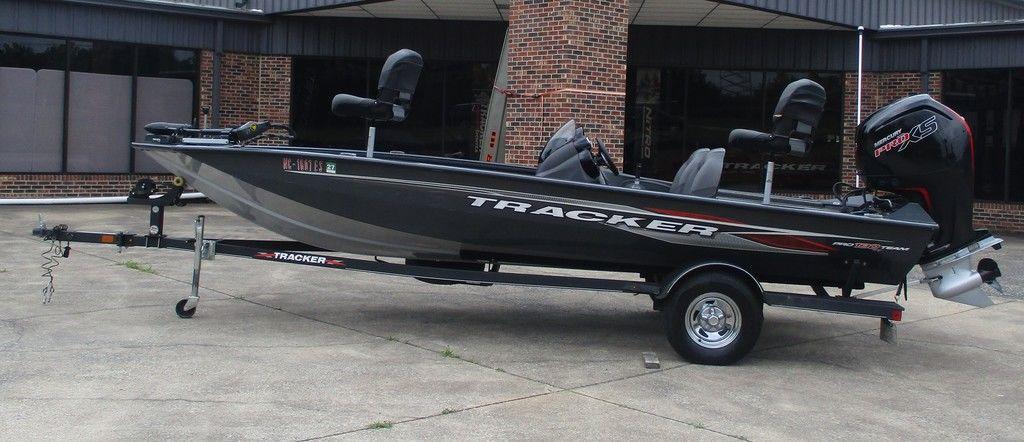 Tracker Pro Team 190 TX 2021 Tracker Pro Team™ 190 TX boat on trailer, parked outside a building.