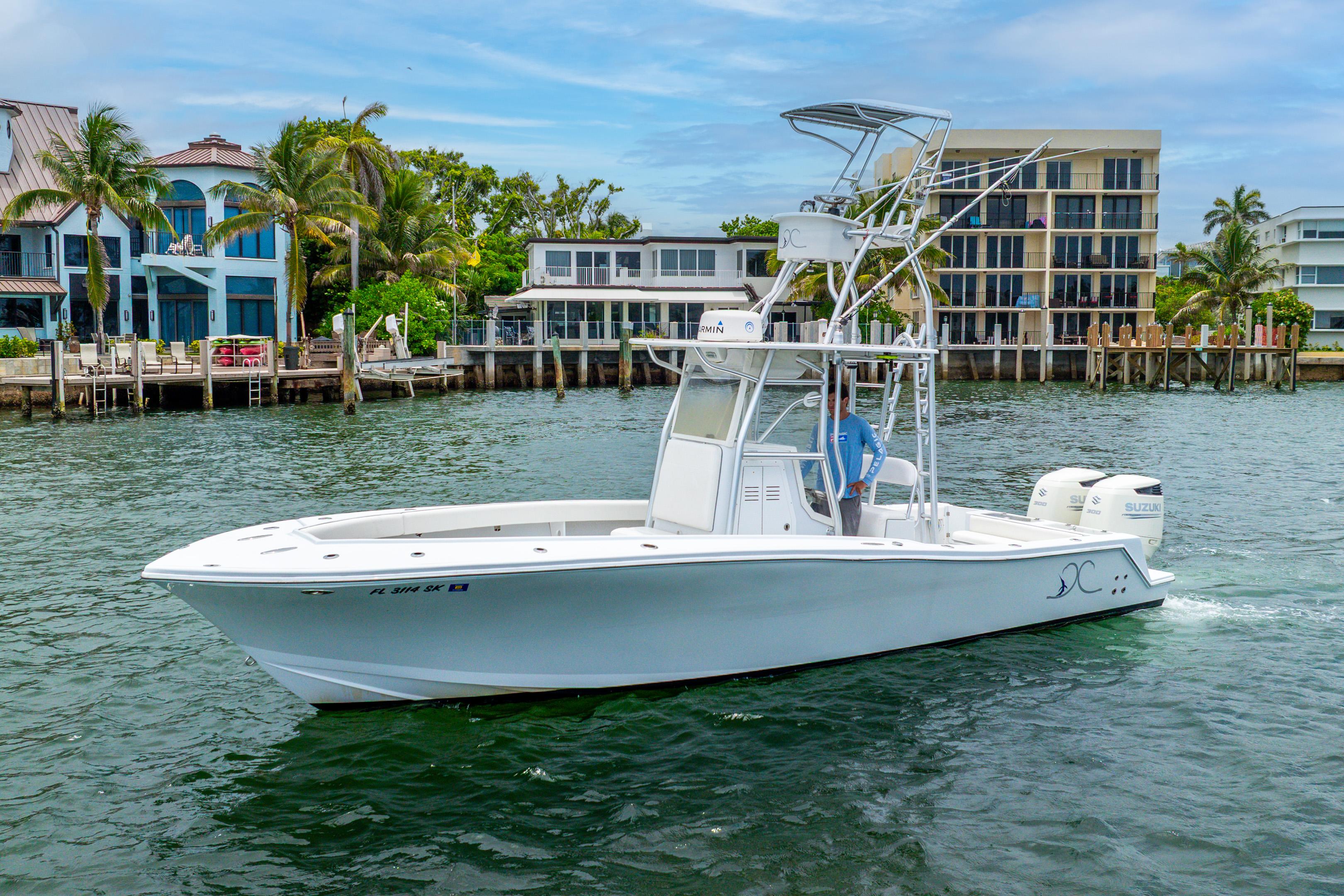 Ocean Runner 29 2018 Ocean Runner 29 boat cruising near waterfront homes.