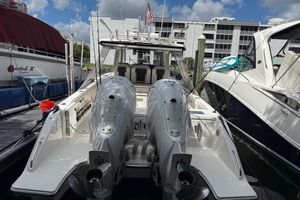 Pursuit S 358 Sport 2022 Pursuit S 358 Sport boat docked with dual outboard engines.