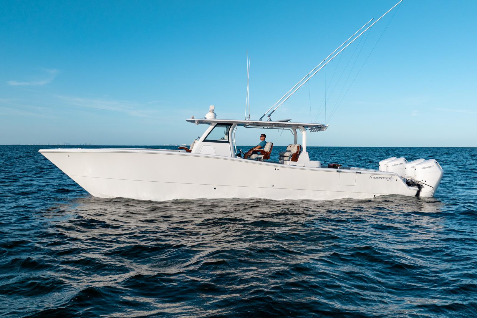 Freeman 43 2023 Freeman 43 boat cruising on open water under clear blue sky.