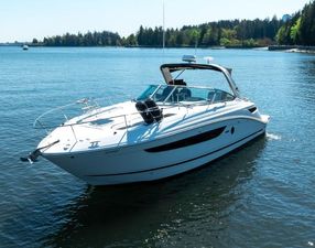 Sea Ray 350 Sundancer 2014 Sea Ray 350 Sundancer yacht on calm water, surrounded by trees.
