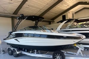 Crownline Eclipse E260 XS 2026 Crownline Eclipse E260 XS boat in showroom on trailer.