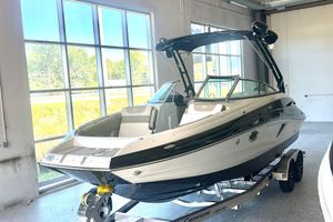 Crownline Eclipse E260 XS 2026 Crownline Eclipse E260 XS boat displayed indoors on a trailer.