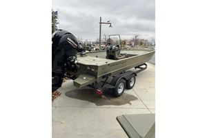 Tracker Grizzly 1860 CC 2026 Tracker Grizzly 1860 CC boat on trailer, parked outdoors.