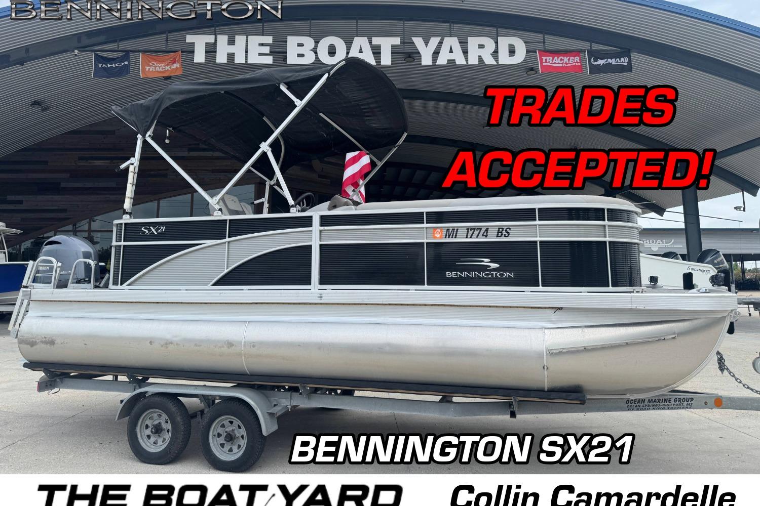 Bennington sx21 2021 Bennington SX21 pontoon boat at dealership, trades accepted, displayed on trailer.