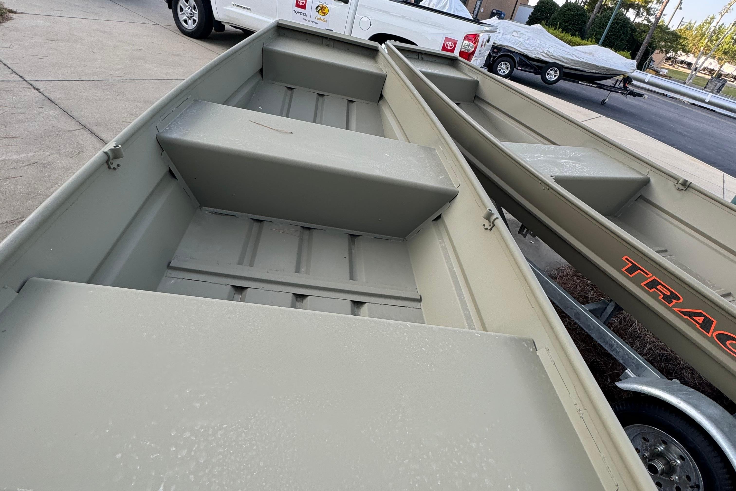 Tracker Grizzly 12 Jon 2025 Tracker Grizzly 12 Jon boat on trailer, parked outdoors.